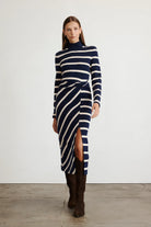 Brindy dress with long sleeves, navy and white stripes, a twist knot waist and a mock neckline-sassanova