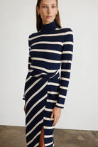 Brindy dress with long sleeves, navy and white stripes, a twist knot waist and a mock neckline-sassanova