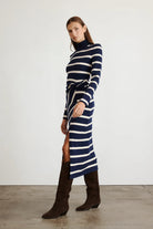 Brindy dress with long sleeves, navy and white stripes, a twist knot waist and a mock neckline-sassanova