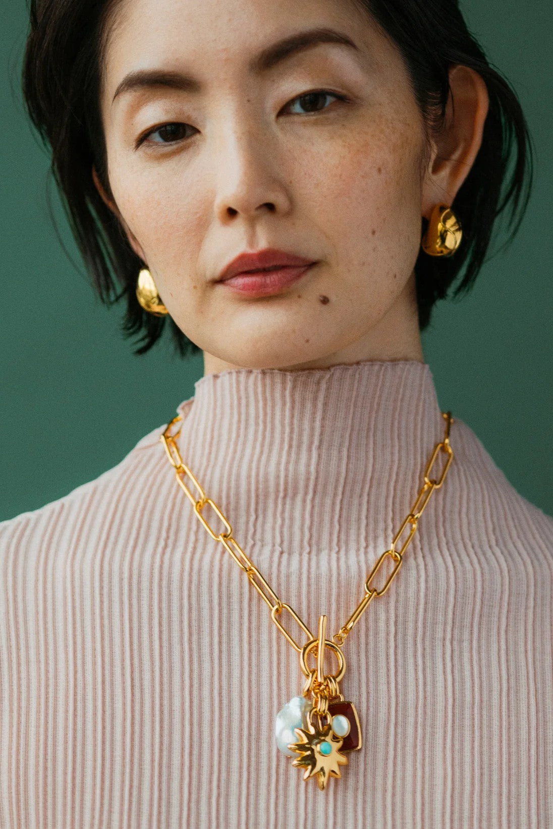 HELIOS CHARM NECKLACE in MERLOT - Necklaces - Sassanova