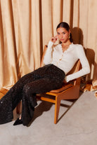 BLISS SCALLOP EDGE CARDIGAN in cream color with long sleeves and scalloped neckline