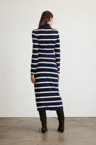 Brindy dress with long sleeves, navy and white stripes, a twist knot waist and a mock neckline-sassanova