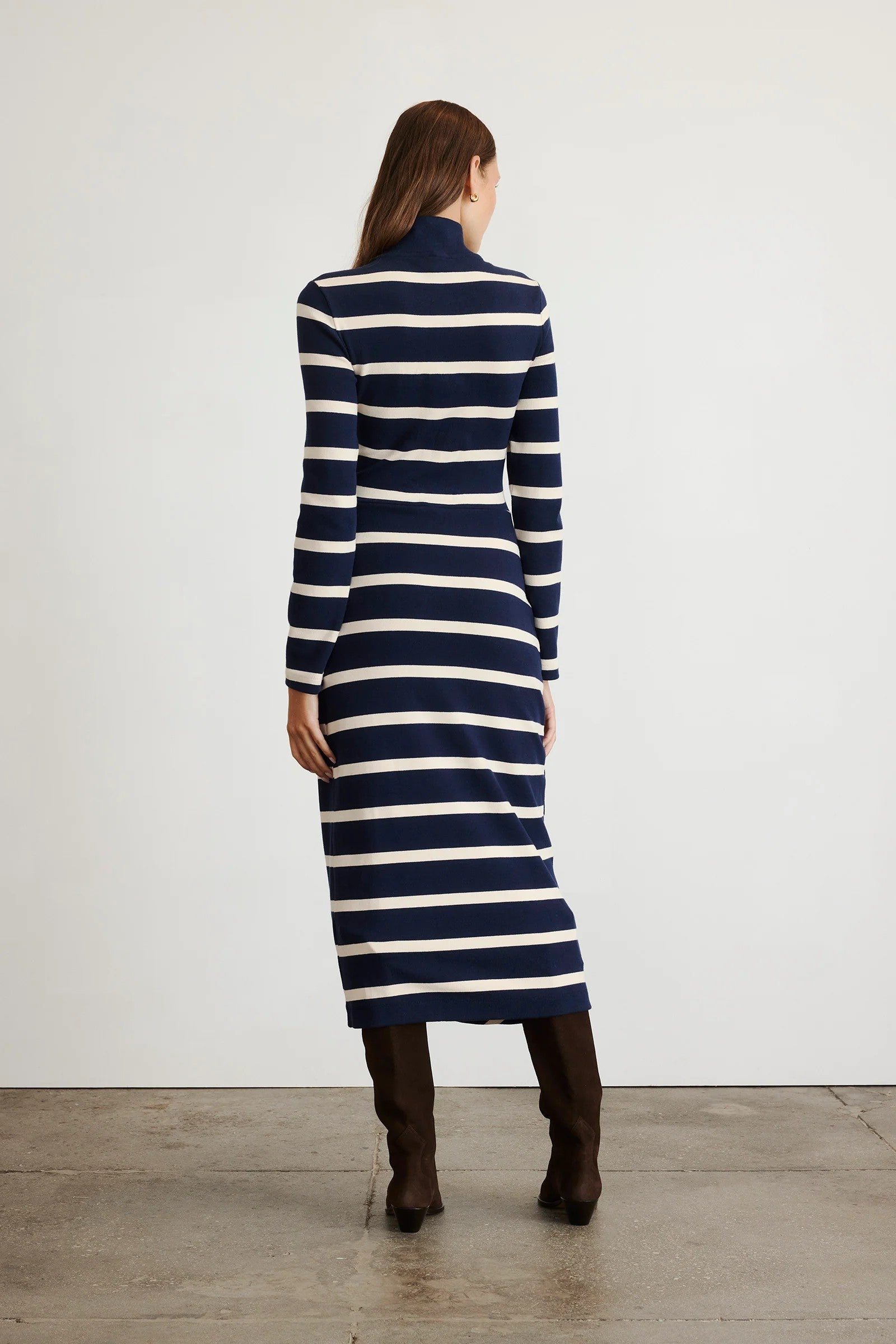Brindy dress with long sleeves, navy and white stripes, a twist knot waist and a mock neckline-sassanova