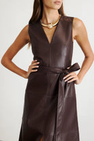 Vegan leather Reina dress in a solid oxblood color with a-line skirt and tie waist-sassanova