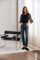CONTRAST LORY TOP with black shirt base and long zebra print sleeves-sassanova