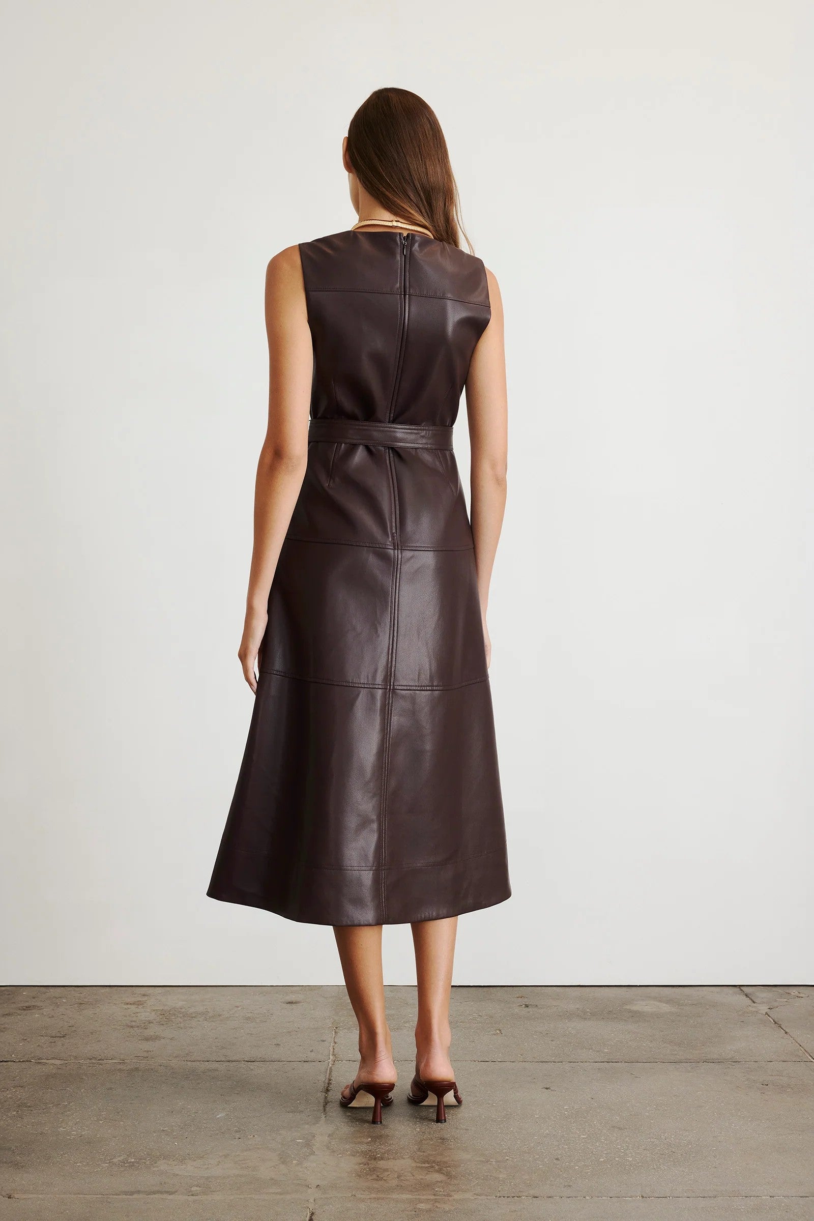 Vegan leather Reina dress in a solid oxblood color with a-line skirt and tie waist-sassanova