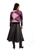 Long sleeved argyle crewneck sweater with mauve, pink, black, and white argyle print and black color blocked trim-sassanova