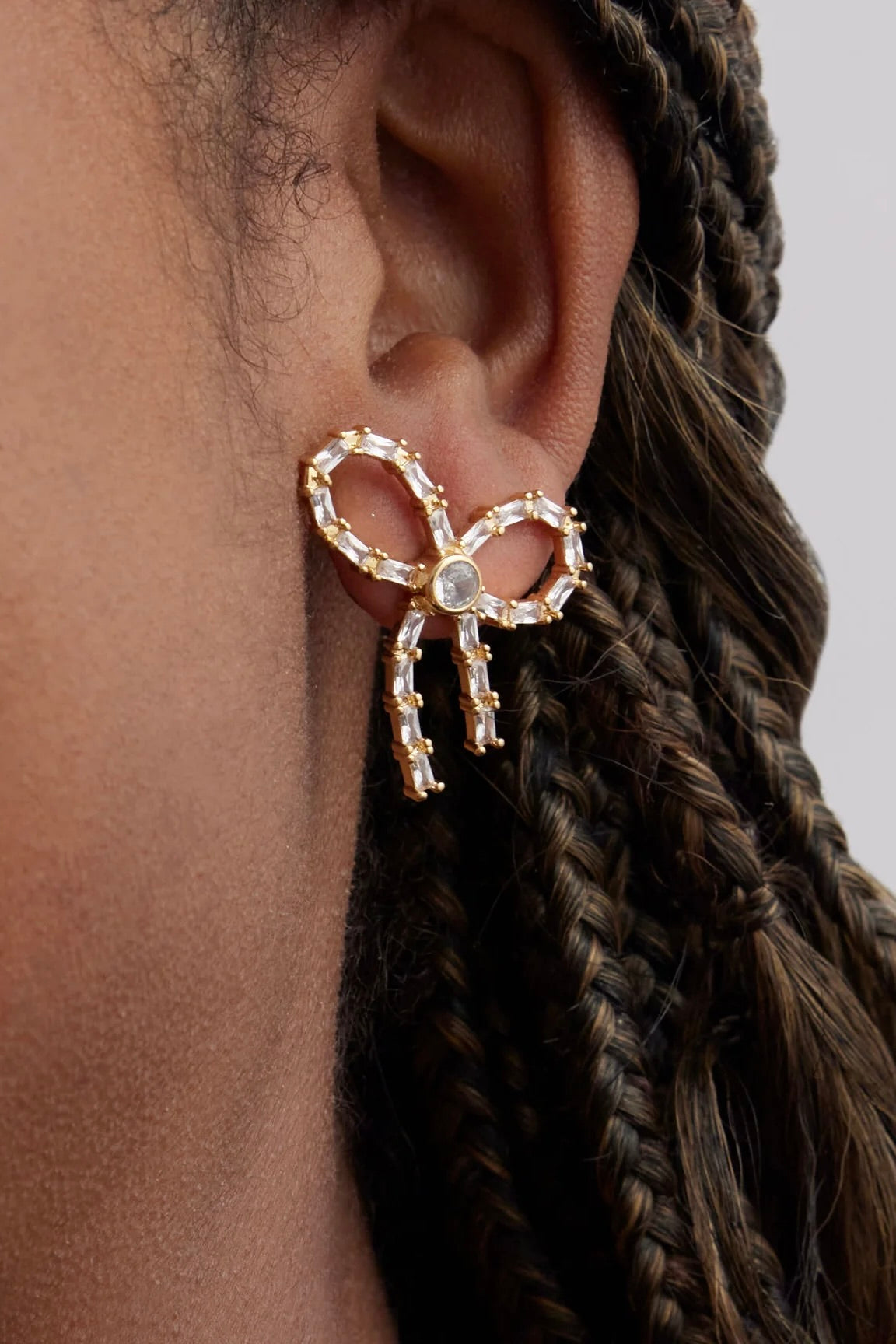 CRYSTAL BOW STUDS- GLD/CLEAR
sassanova