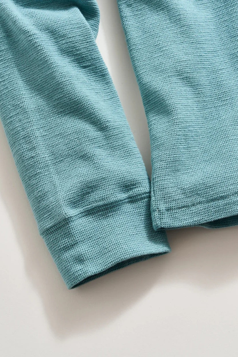 close up of long sleeved slub tuck henley in steel blue-novaman